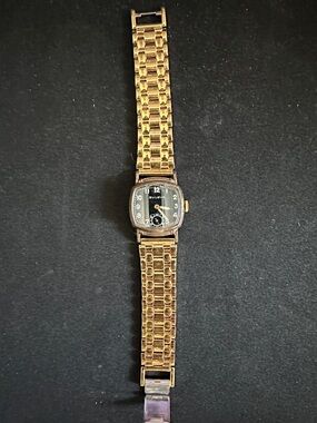 Bulova Gold Tone Watch with Black Dial and Linked Bracelet